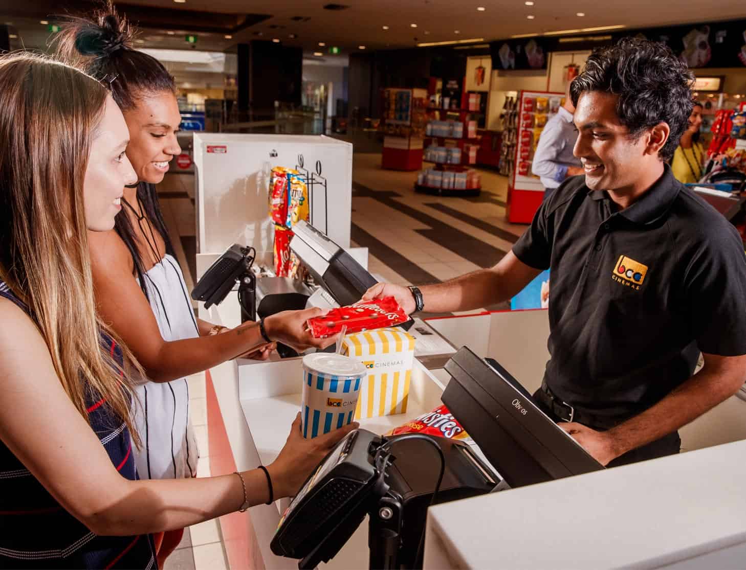 Person buying movie ticket